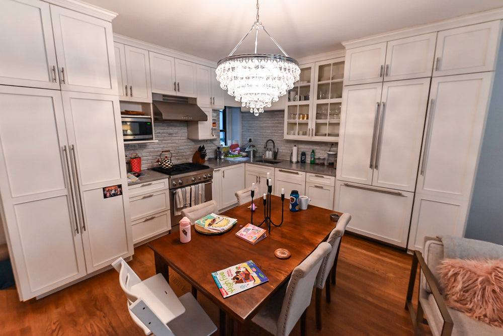 Chef-grade Thermador range integrated into transitional white kitchen cabinetry