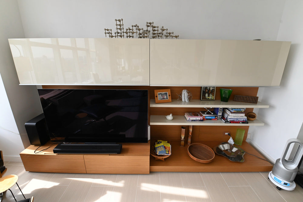Luxury Italian media unit by Poliform with integrated storage and display shelves