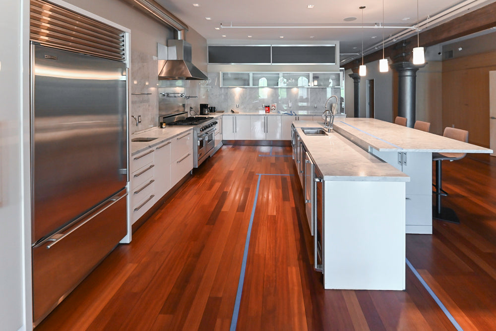 Luxury modern white cabinetry with Viking refrigerator and range