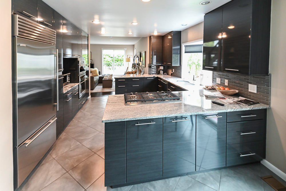 UltraCraft modern black kitchen with horizontal grain thermofoil cabinetry and appliances