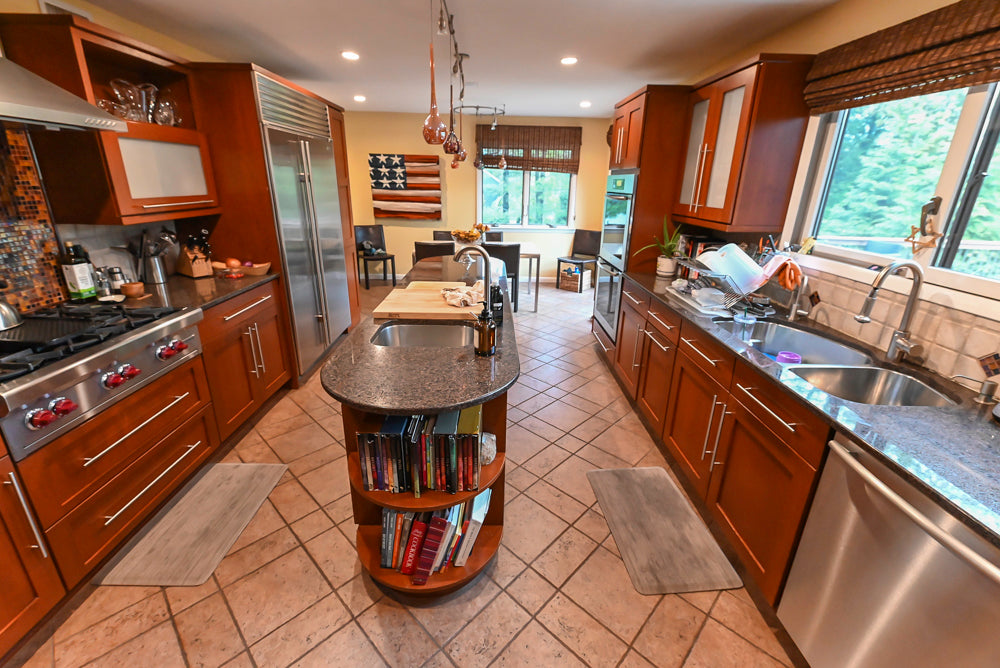 Pre-owned Plain and Fancy classic kitchen layout with built-in Sub-Zero refrigeration