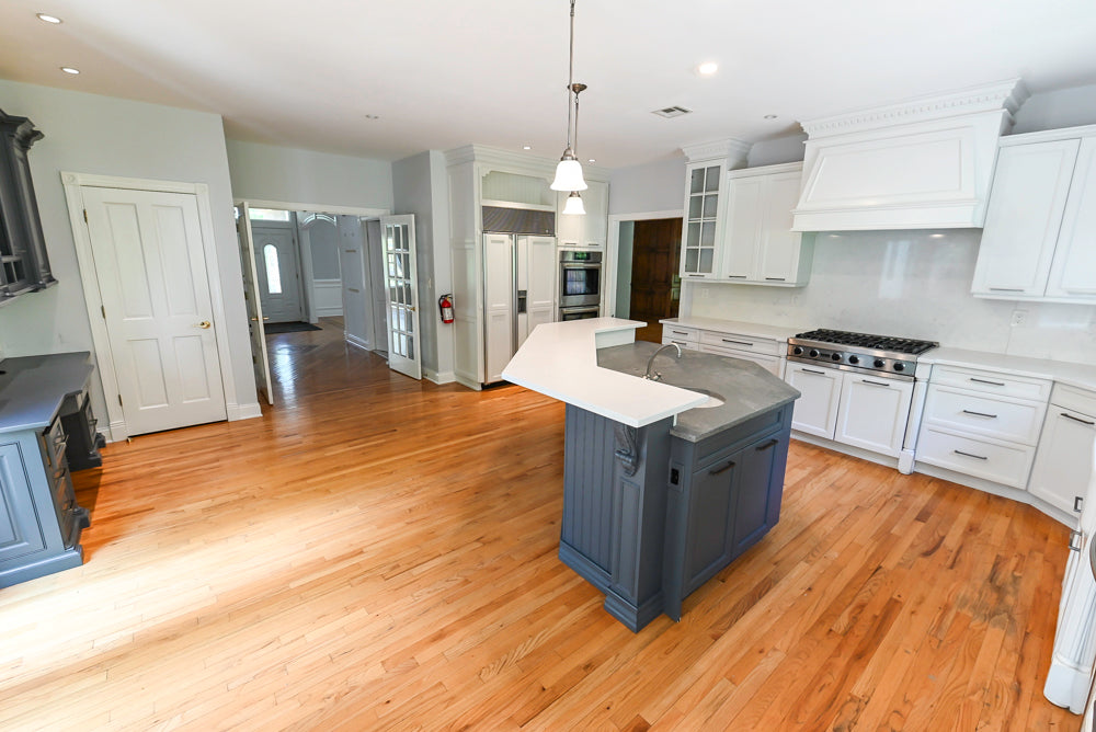 Pre owned premium kitchen island in navy blue with open shelving and deep pot drawers