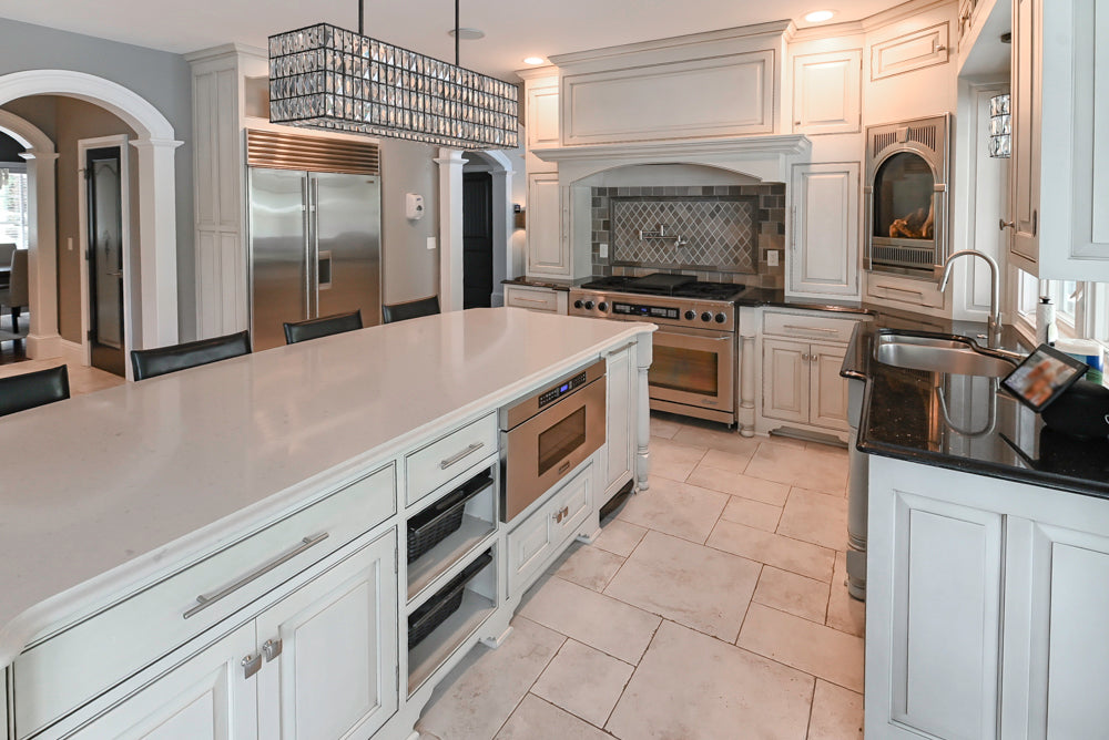 The Abernathy grand off-white traditional kitchen with island and Sub-Zero refrigerator