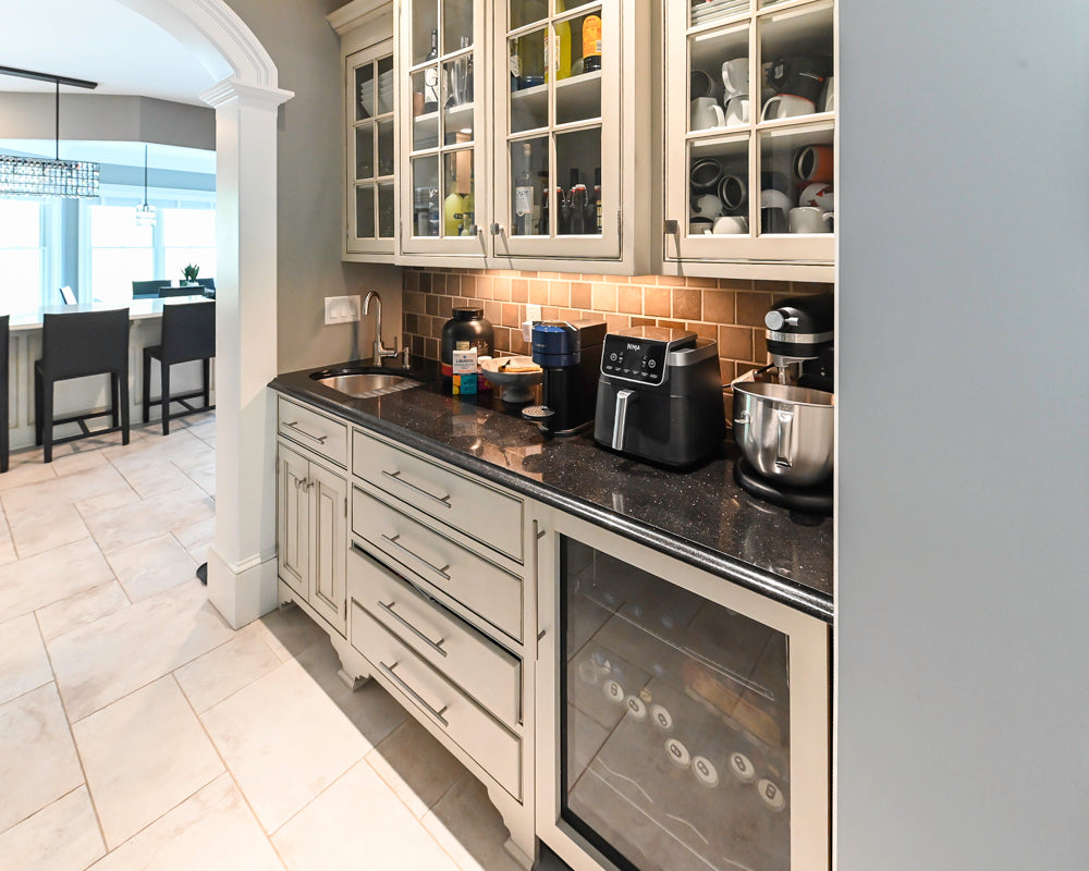 The Abernathy grand off-white traditional wet bar with beverage cooler and sink