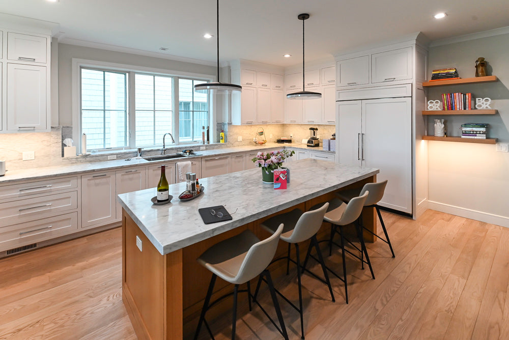 The Banbury transitional full kitchen set with white perimeter cabinetry and natural white oak island