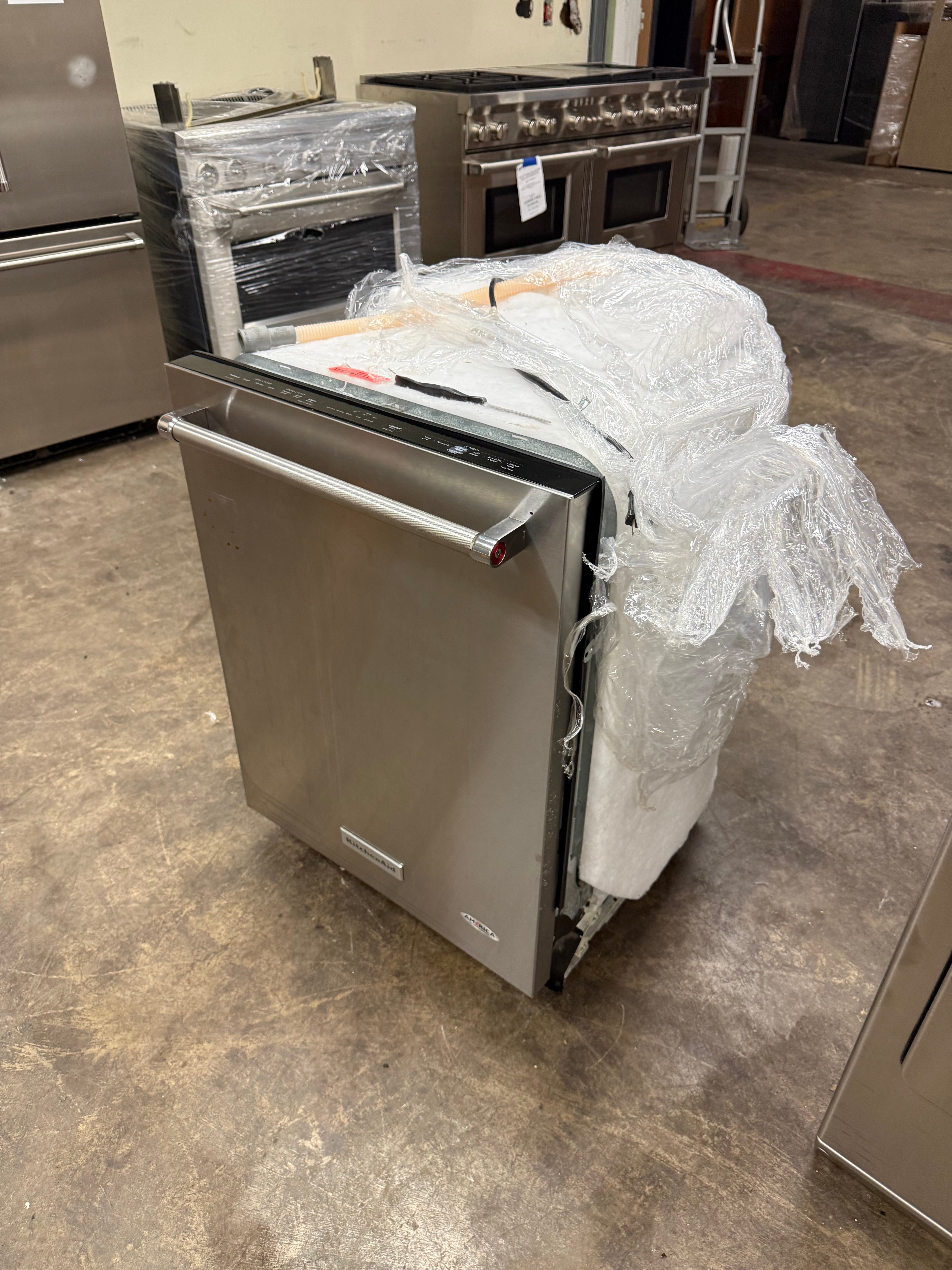 Premium silent 39 dBA KitchenAid dishwasher door open showing 3rd level rack and stainless steel tub