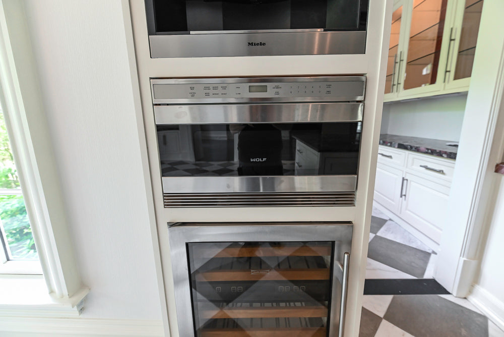 "The Dove" Transitional White Kitchen with Wolf 60" Range & Sub-Zero