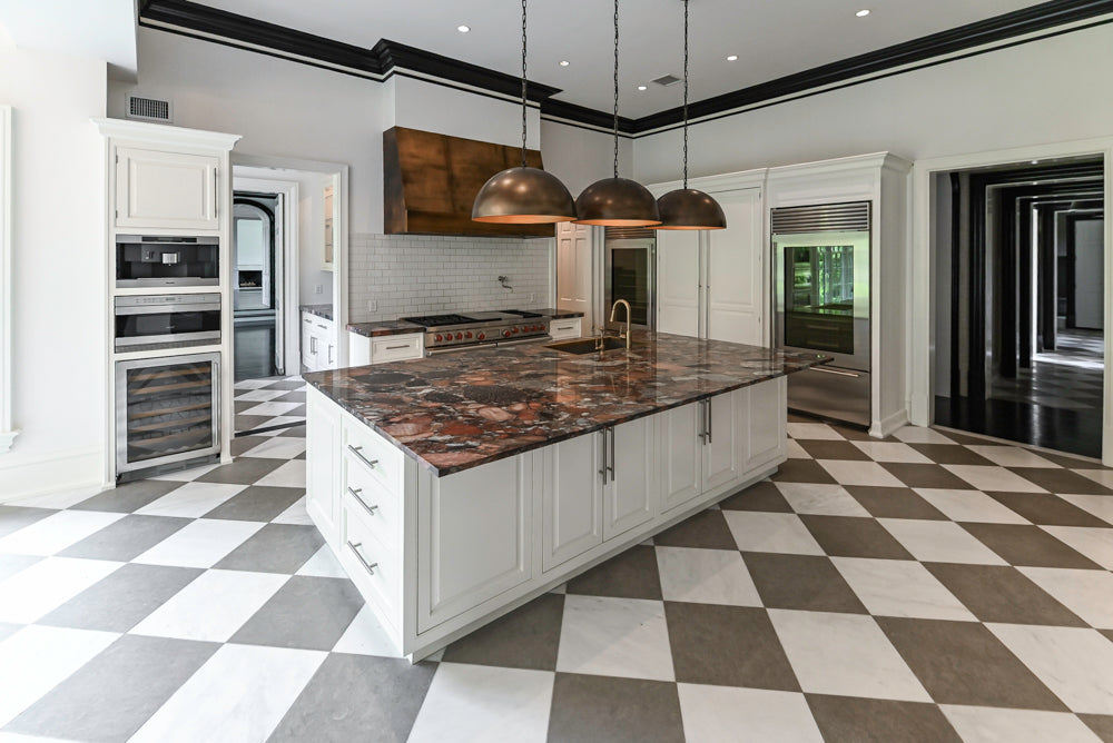 The Dove transitional luxury white kitchen suite featuring custom cabinetry Wolf 60 inch range and Sub Zero refrigeration