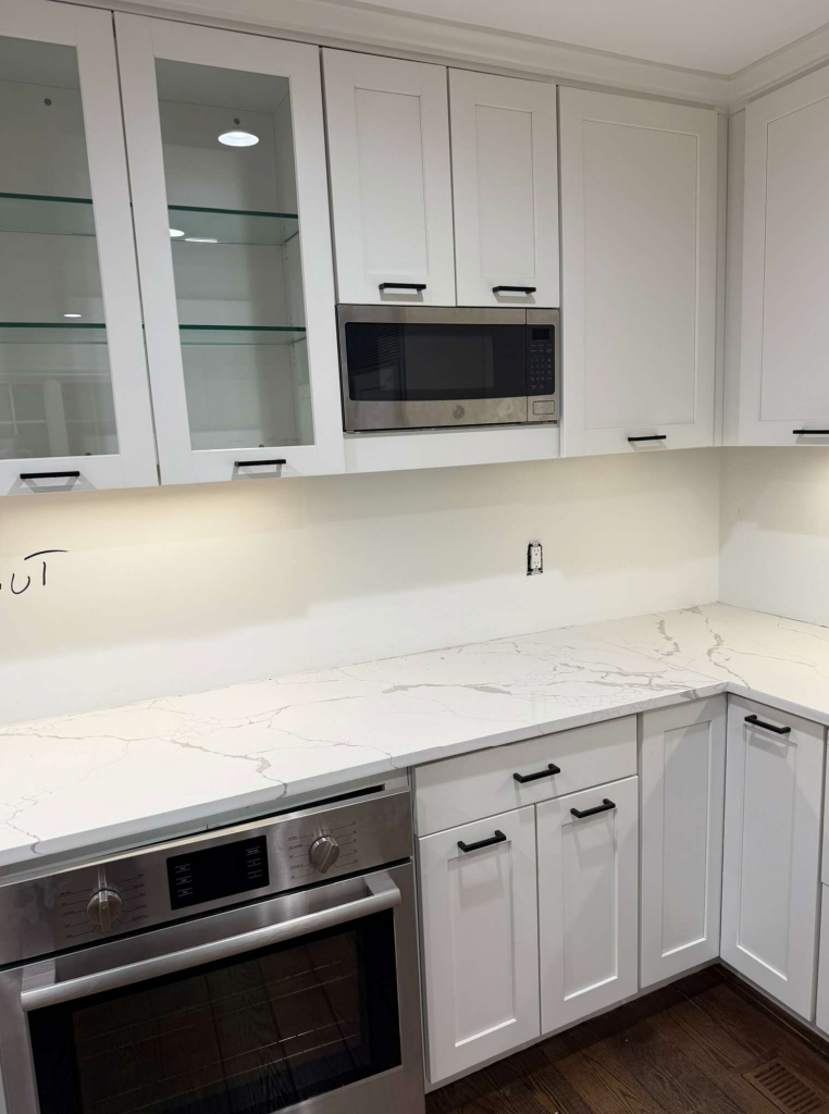 ÒThe WesterlyÓ Transitional White Kitchen with Island, 48" Sub-Zero Refrigerator and Bosch Appliances