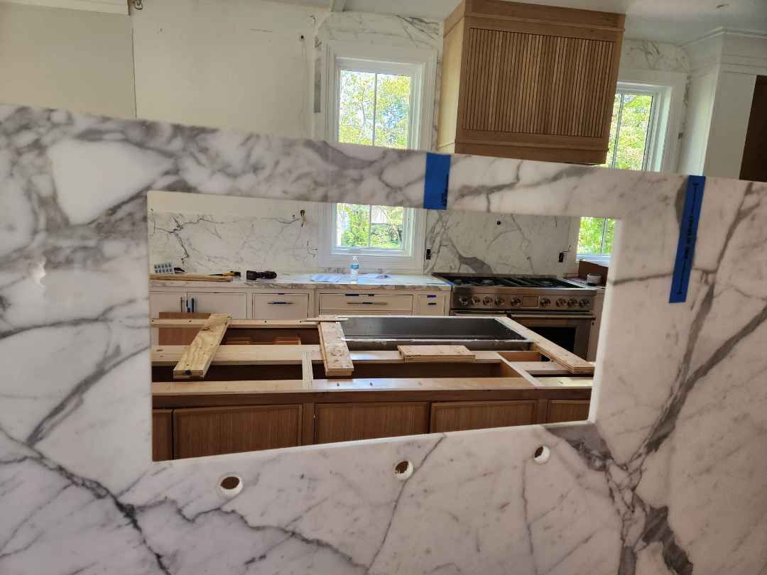 Custom Transitional White Kitchen with Natural Wood Toned Island, White Marble Countertops and 48" Wolf Range