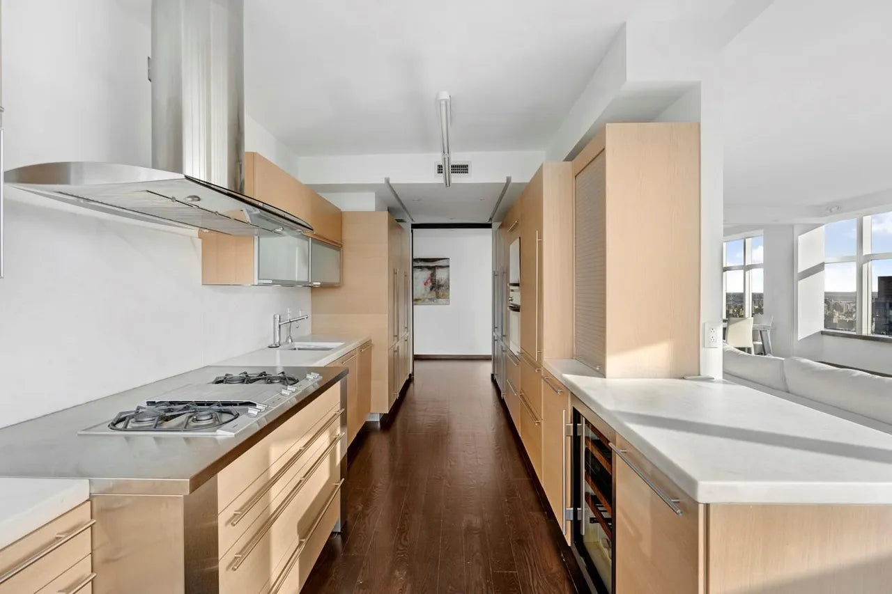 Poggenpohl Modern Light Wood Veneer Kitchen with White Marble Countertops and Appliances