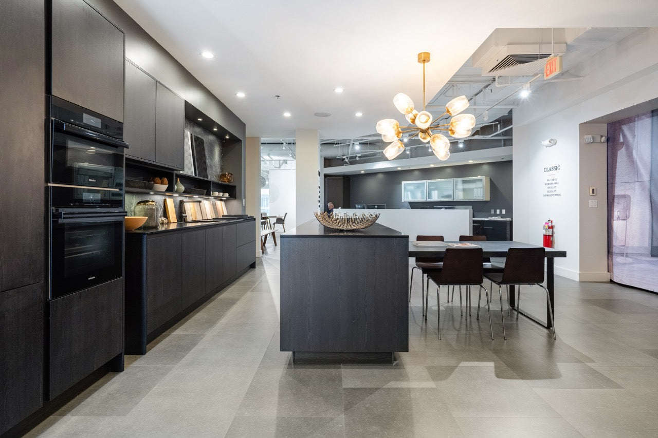 Minimalist SieMatic kitchen island with raised breakfast wood bar