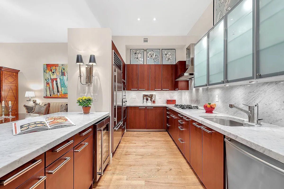 Poggenpohl Brown Toned Transitional Kitchen with Marble Countertops and Appliances