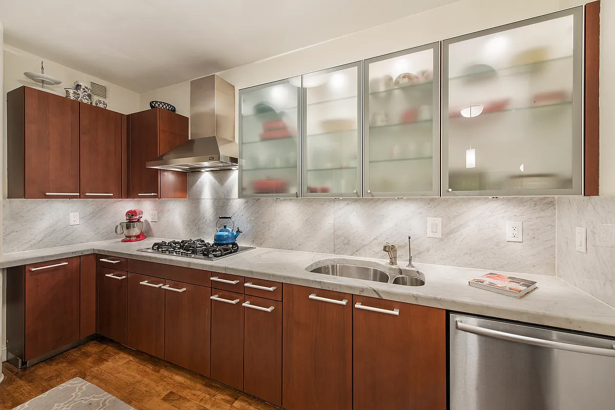 Poggenpohl Brown Toned Transitional Kitchen with Marble Countertops and Appliances