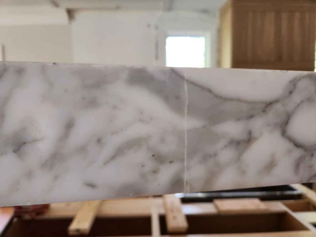 Custom Transitional White Kitchen with Natural Wood Toned Island, White Marble Countertops and 48" Wolf Range