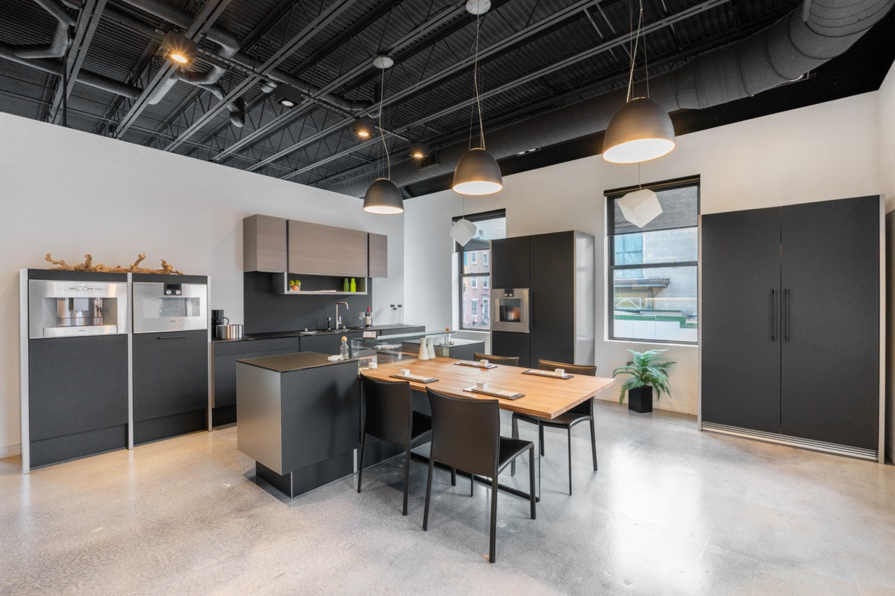 Poggenpohl Porsche Modern Matte Grey Kitchen with Wood Top Seating Area and Gaggenau Appliances