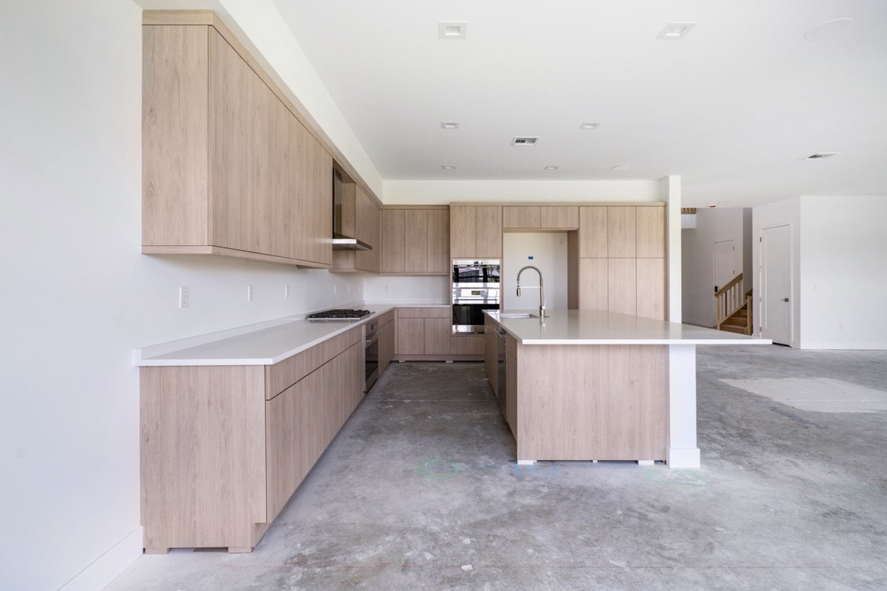 Luxury natural oak wood cabinets with integrated high end Wolf appliances