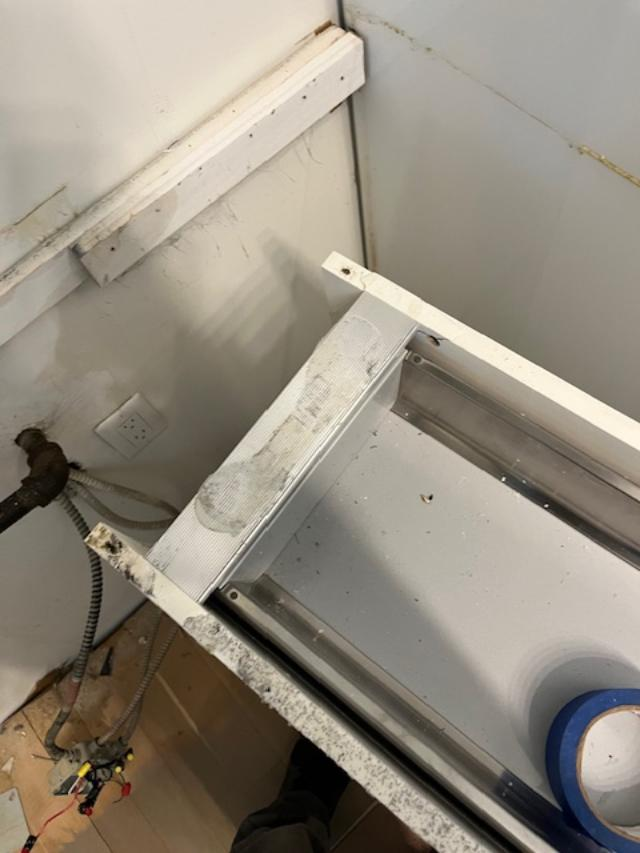 Cesar Modern Glossy White Kitchen with Black Granite Countertops & Appliances