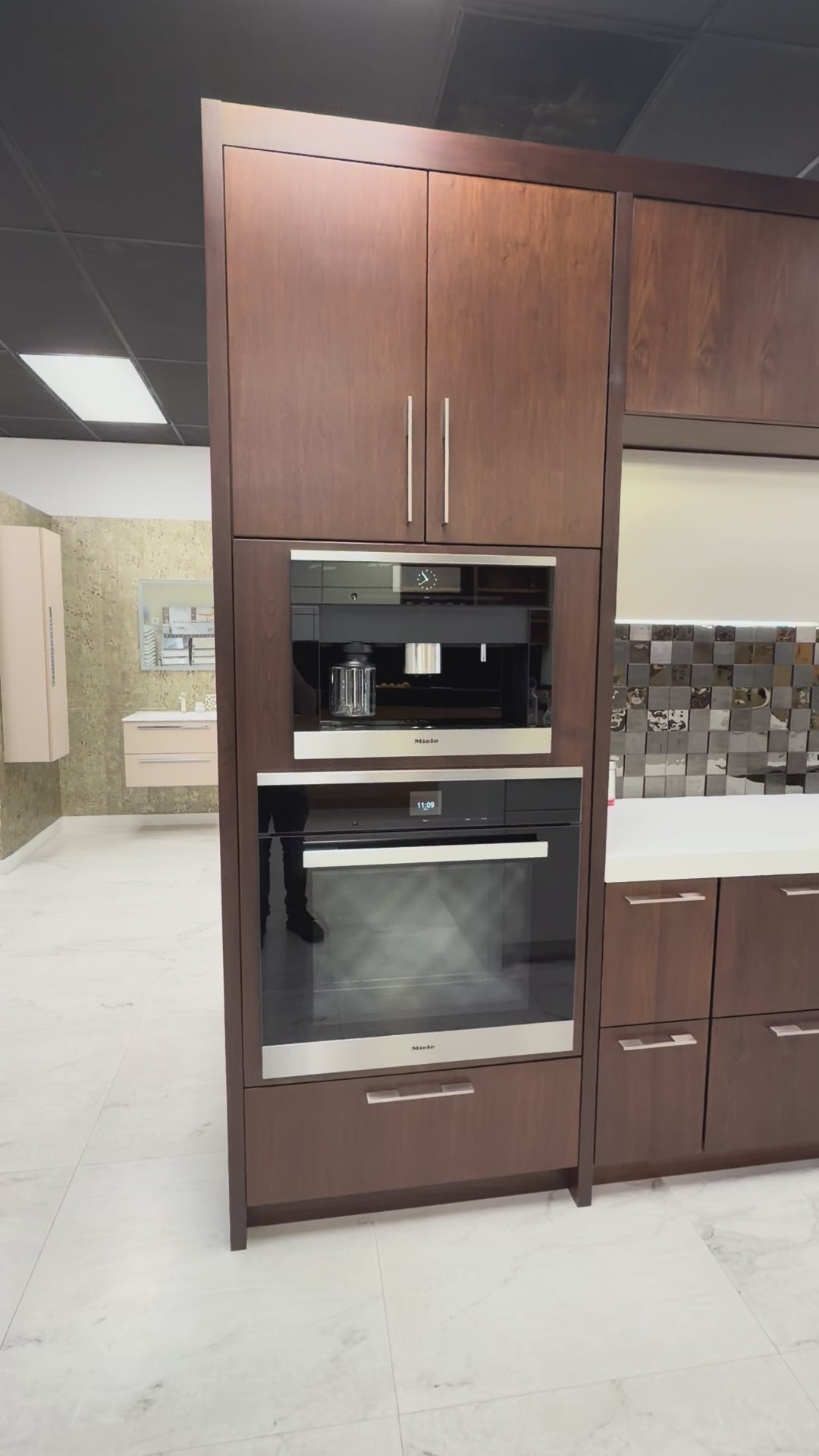 Load video: Wood-Mode modern gloss white and natural wood stain kitchen cabinets with island