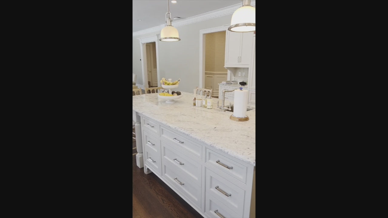 Load video: "The Berkley" Transitional White Kitchen with Island and 60" Wolf Range