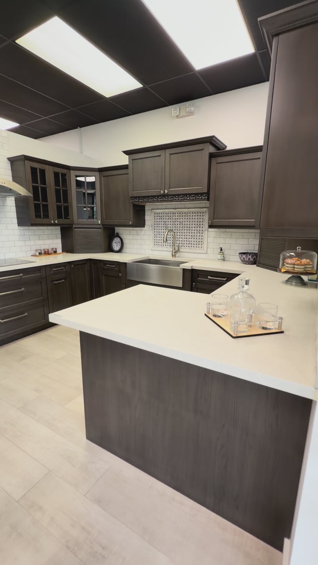 Load video: Kitchen Kraft transitional maple kitchen display with GE Monogram appliances