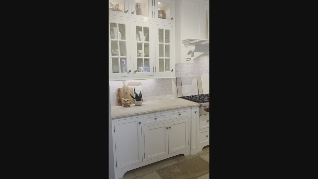 Load video: Signature Custom Cabinetry Transitional White Kitchen with Wood Veneer Top Island and Stone Countertops