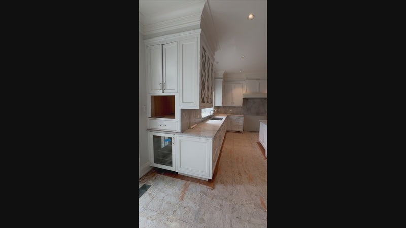 The Blenheim transitional white kitchen cabinets with island and Sub-Zero refrigerators