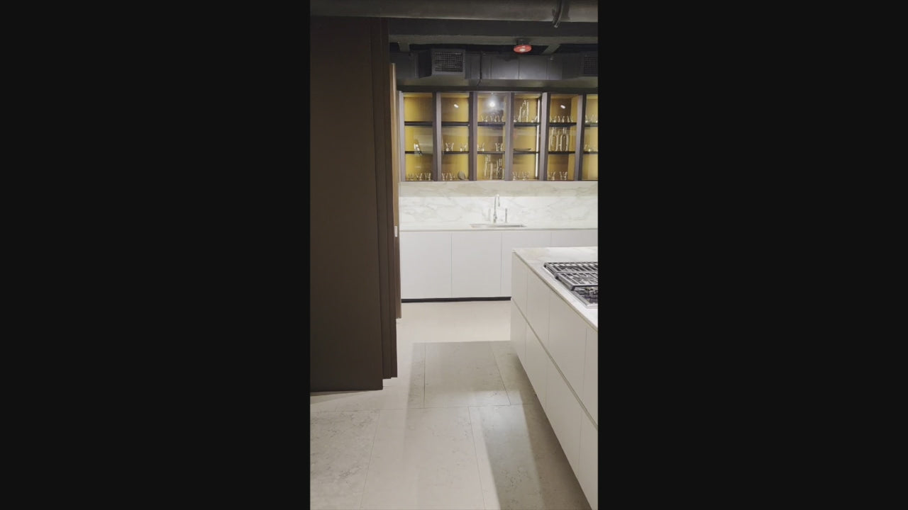 Load video: Poliform Artex Glacier White &amp; Moka Modern Kitchen with Marble Countertops and Sub-Zero &amp; Wolf Appliances