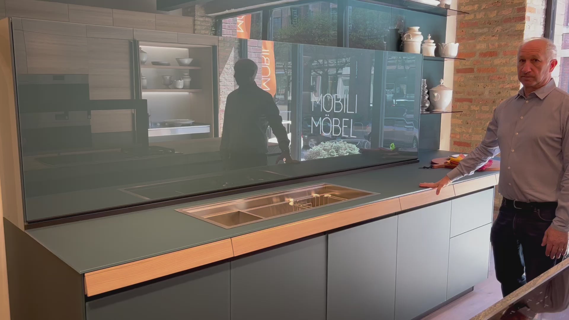 Load video: Valcucine Venture: Green Tea Glass Modern Kitchen with Island &amp; Luxe Appliances