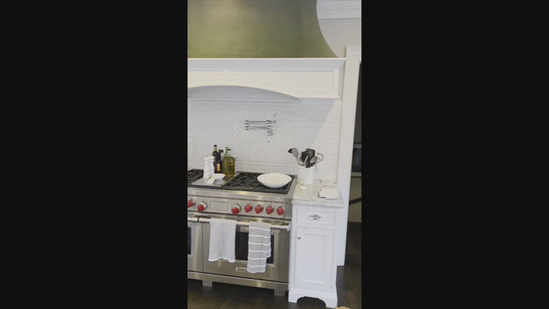 High-end white cabinetry in a luxury transitional kitchen layout