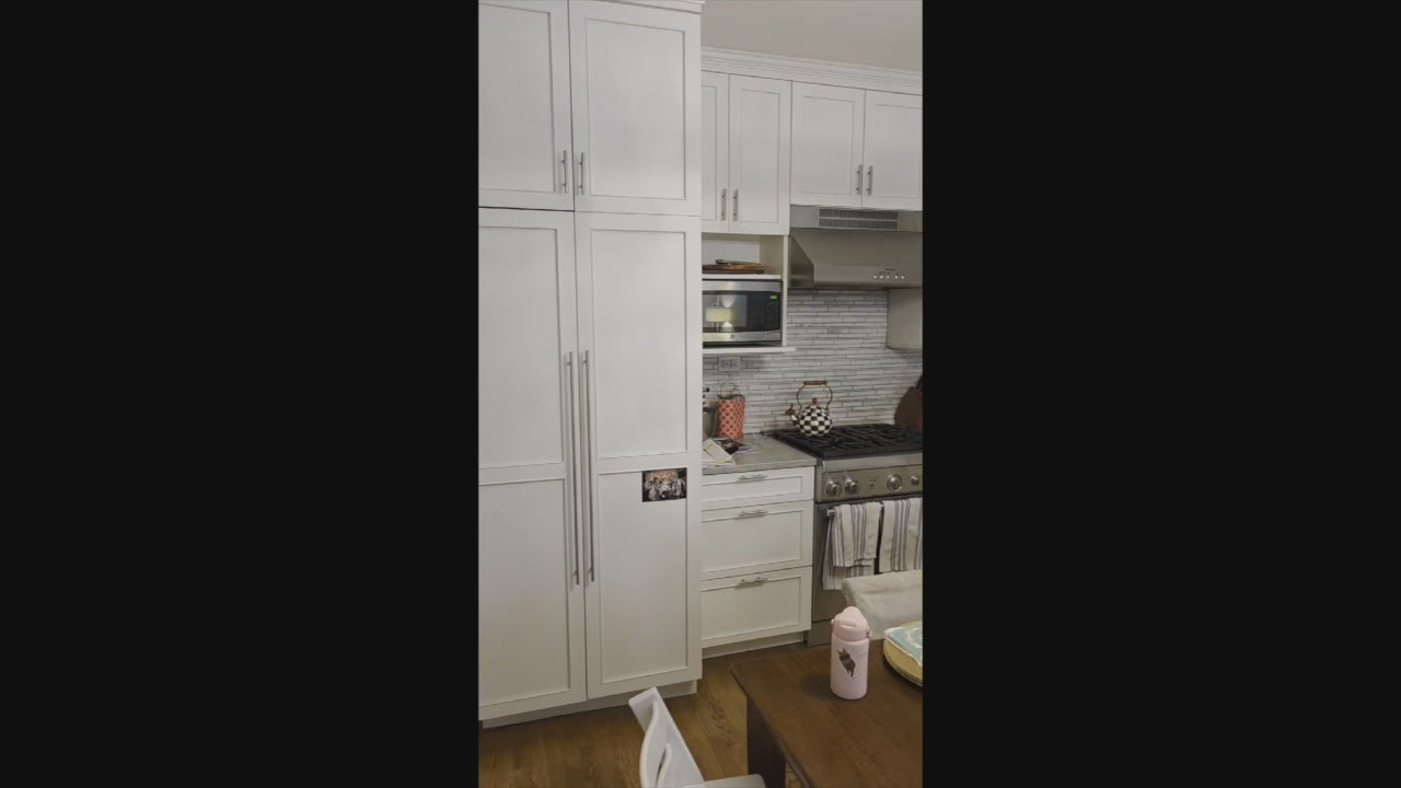 Load video: Plain &amp; Fancy transitional white kitchen cabinetry with Thermador professional range