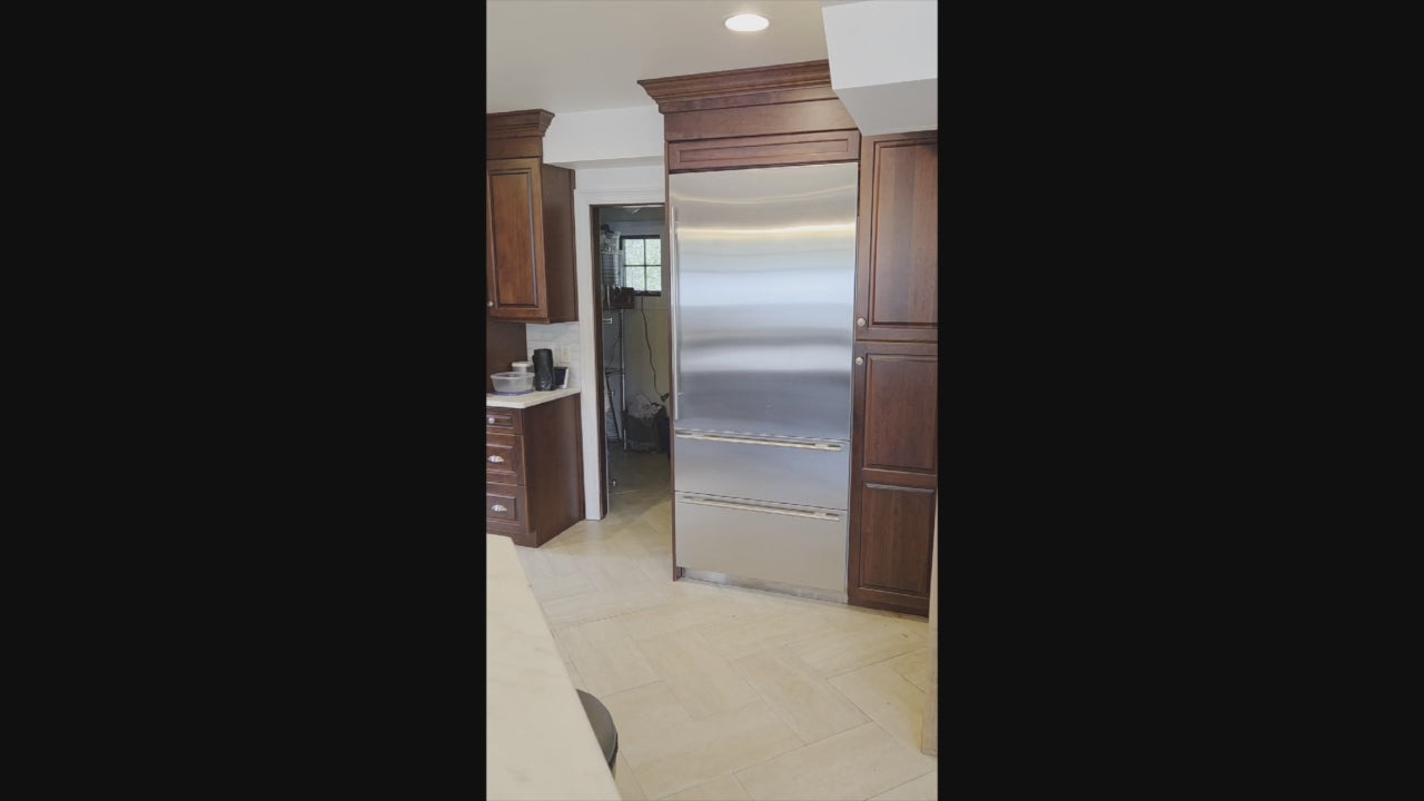 Load video: Custom Traditional Dark Wooden Kitchen with Marble Countertops and Wolf Appliances