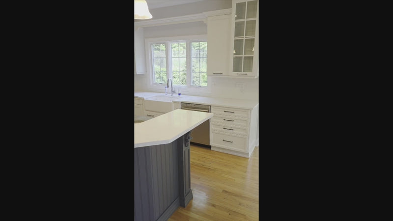 The Montgomery transitional full kitchen set with white perimeter cabinetry and navy blue island