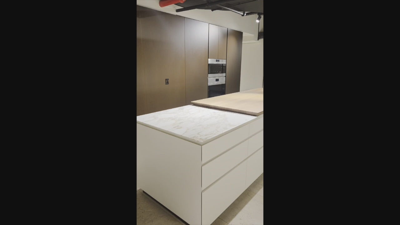 Load video: Poliform Artex Glacier White &amp; Moka Modern Kitchen with Marble Countertops and Sub-Zero &amp; Wolf Appliances