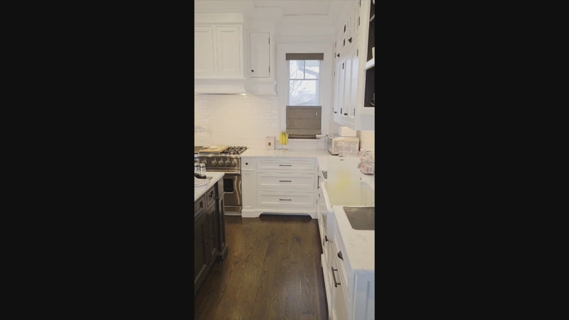 Luxury pre-owned white kitchen cabinets with Sub-Zero refrigeration
