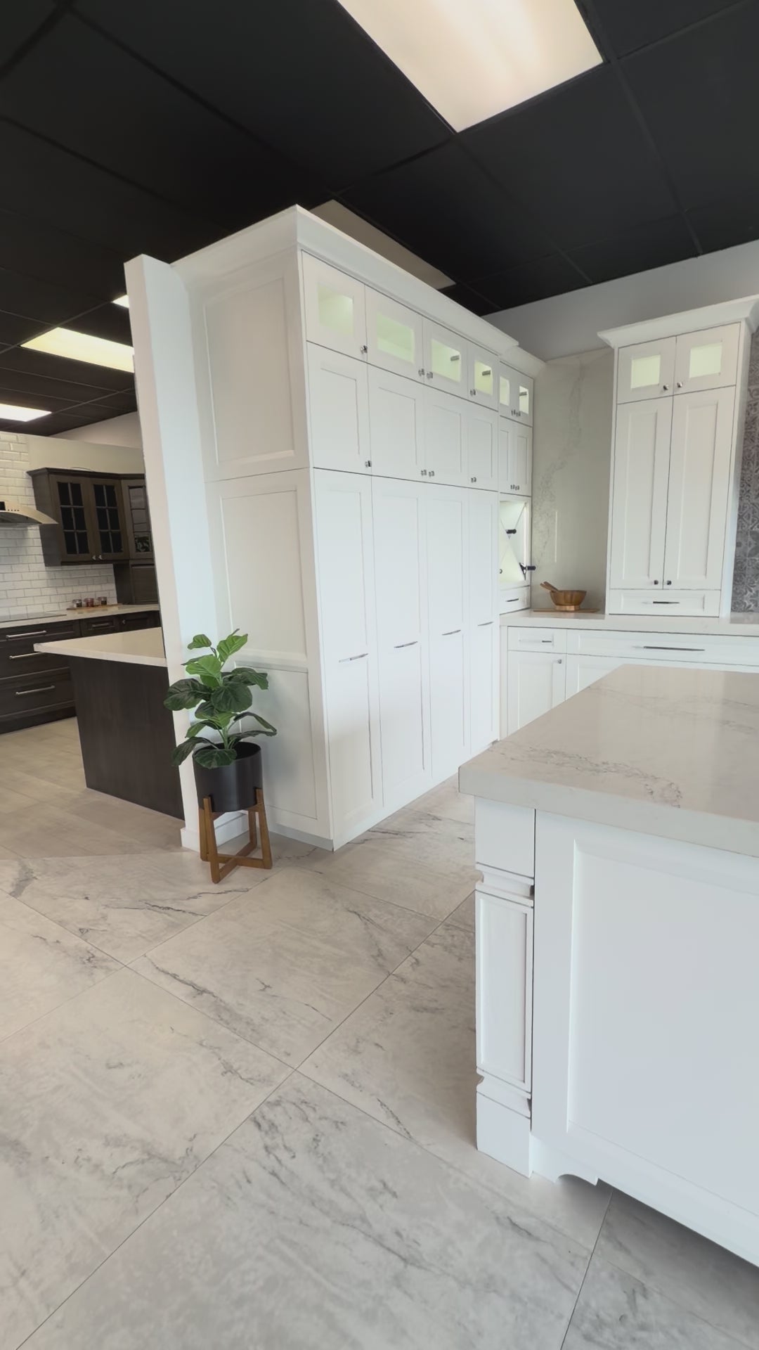 Load video: Bellmont transitional white kitchen display with Bertazzoni appliances