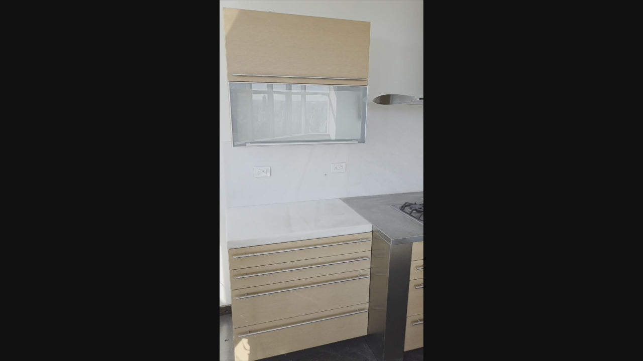 Load video: Poggenpohl Modern Light Wood Veneer Kitchen with White Marble Countertops and Appliances