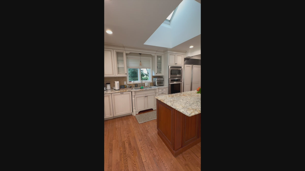Load video: High-end architectural white kitchen suite with integrated home office workstati