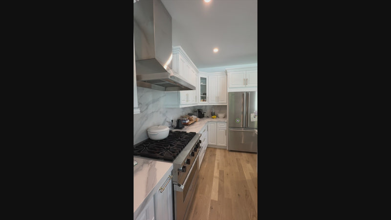 Luxury architectural estate kitchen cabinetry with professional stainless steel range