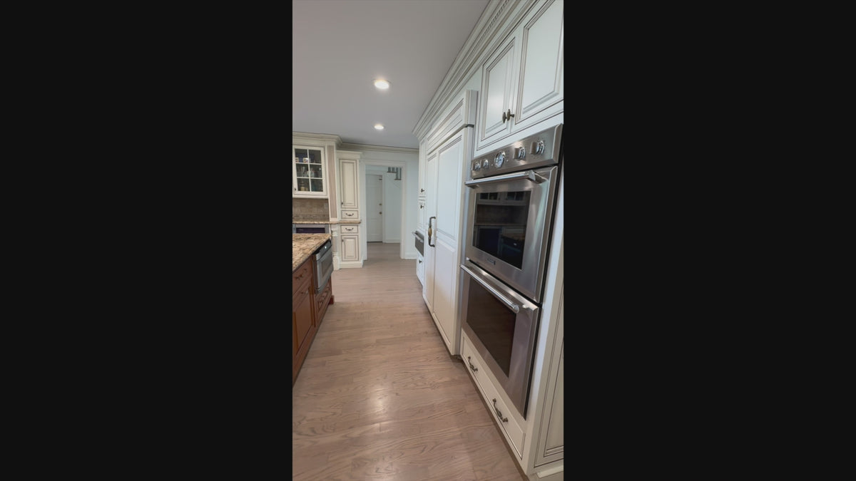 Load video: Luxury showroom display custom wood kitchen cabinets with raised panel doors