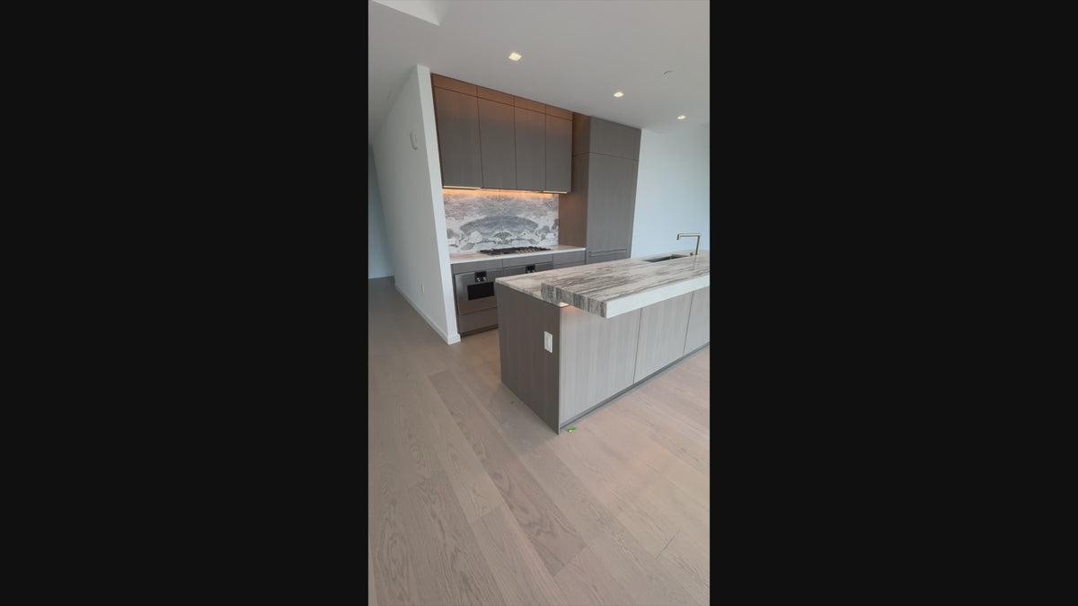 Load video: Unused luxury modern kitchen cabinetry with slab doors