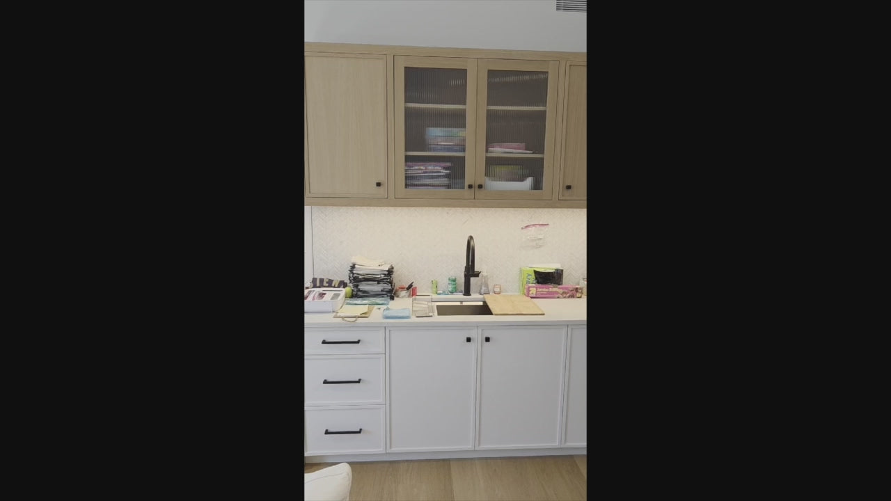 Load video: Rein and Jac transitional white oak kitchenette system front view with sink and faucet