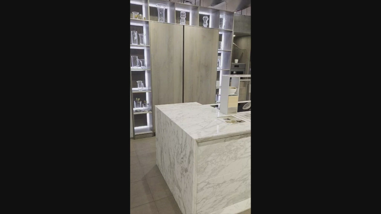 Load video: eggersmann USA Chablis Vintage Oak &amp; Steel Grey Modern Kitchen with Arabescato Waterfall Island and Miele Appliance Suite