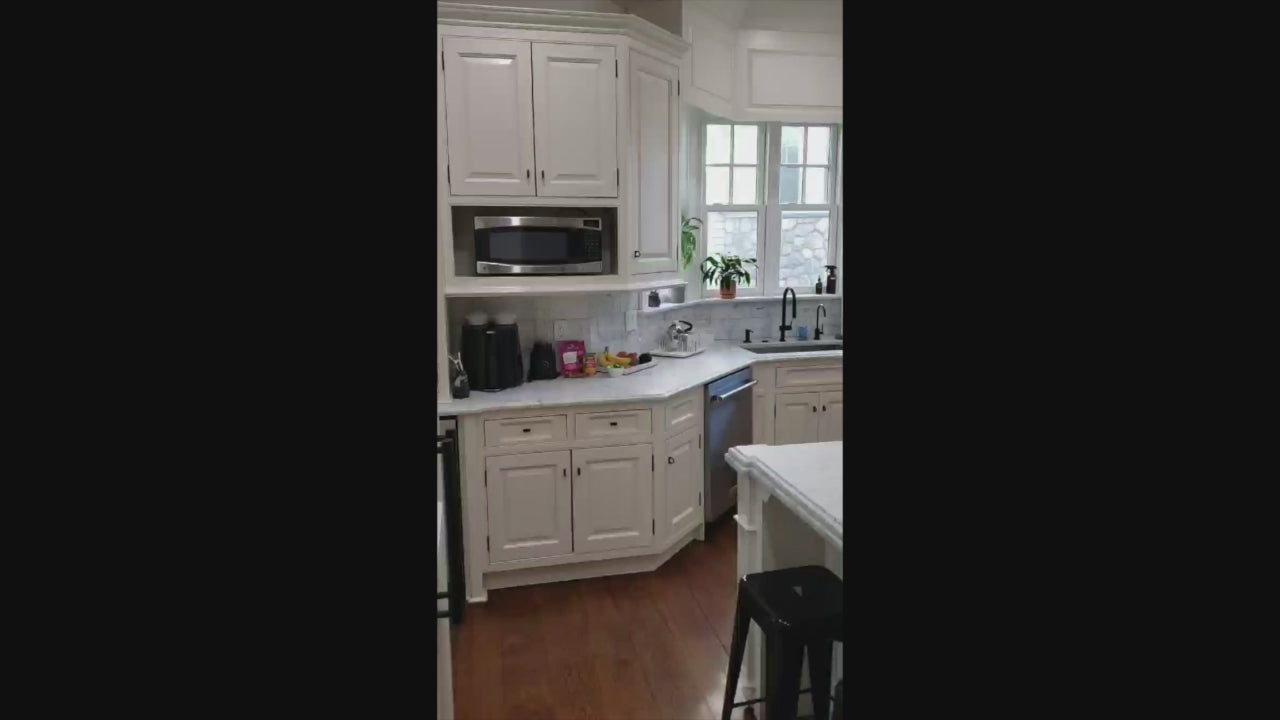 Load video: Traditional Creamy White Kitchen with Island, Marble Countertops and Appliances