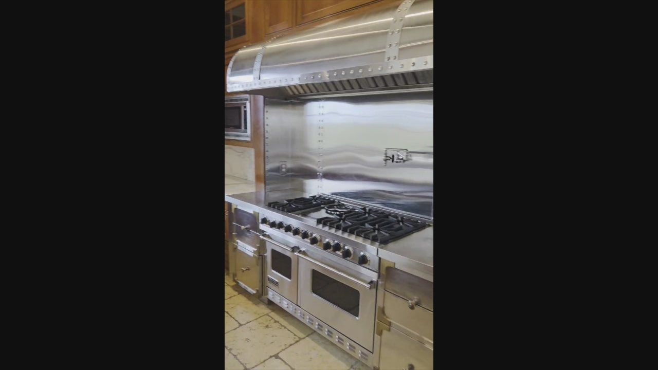 Load video: Classic traditional kitchen suite with custom Viking range hood and raised panel cabinets