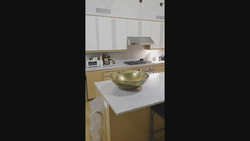 Luxury kitchen island with Poggenpohl cabinetry and stone countertops