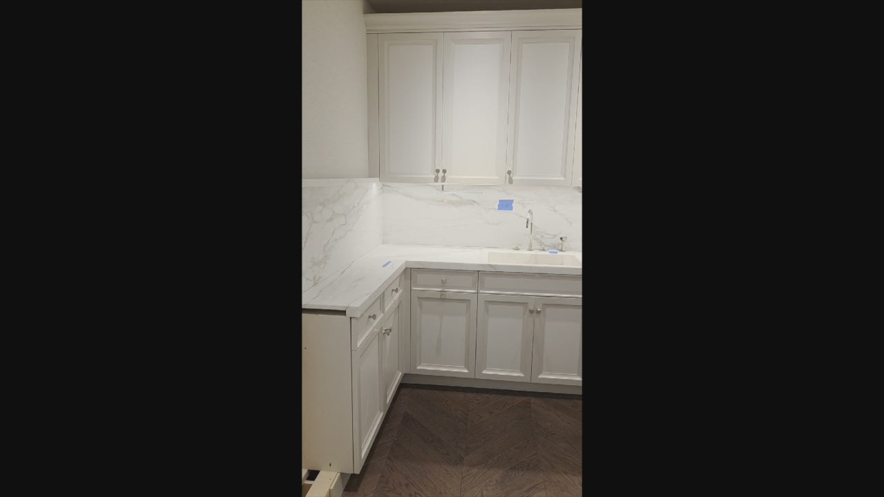 Load video: St. Charles Transitional Two-Tone White Butler's Pantry with Calcatta Marble Countertops