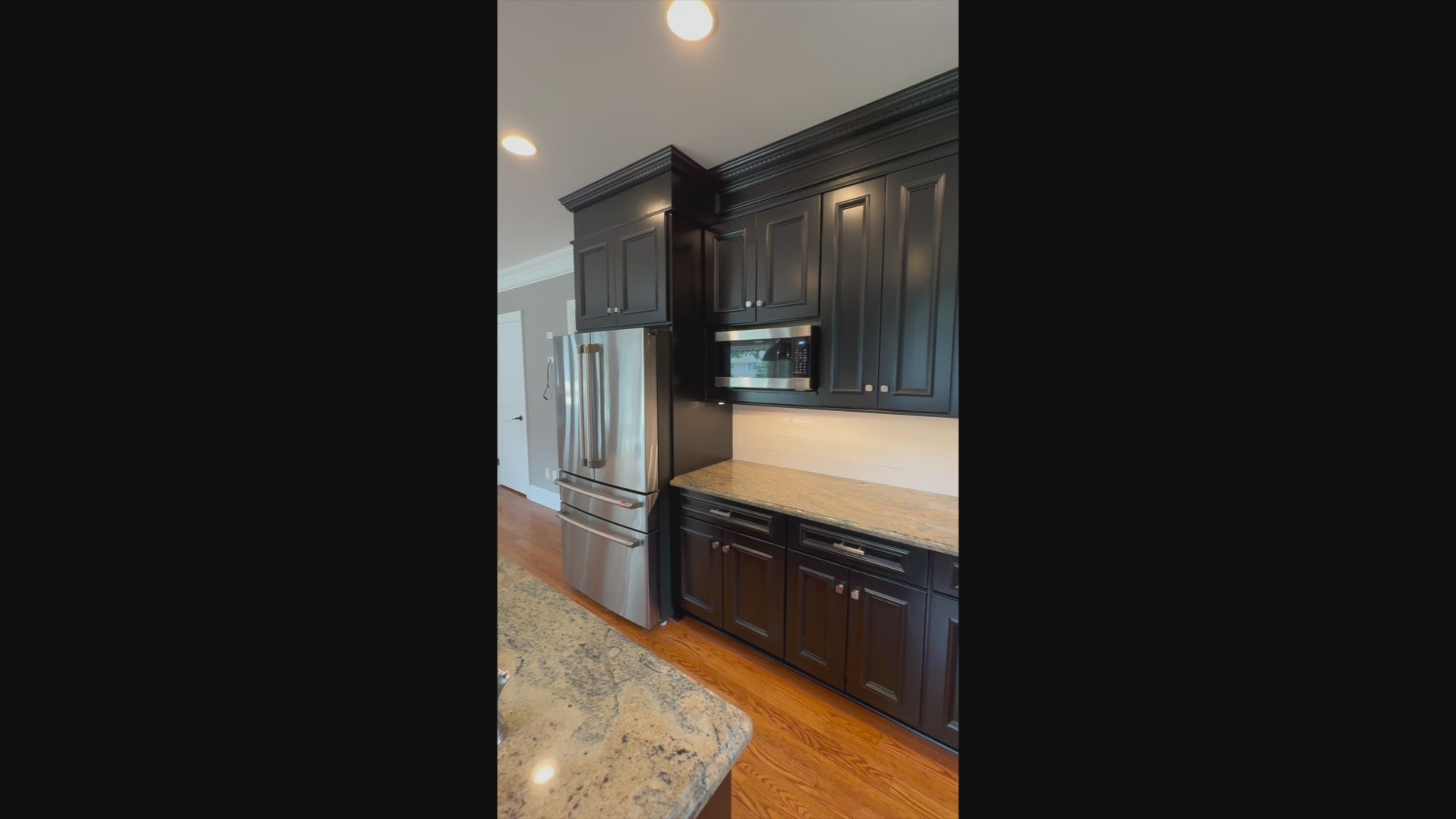Load video: High-end architectural kitchen package in matte black with large island