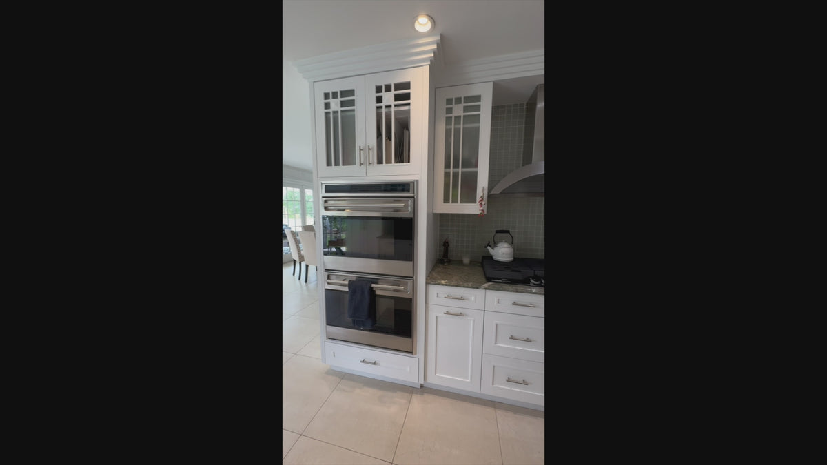 Load video: High-end traditional white kitchen perimeter cabinets and architectural island view