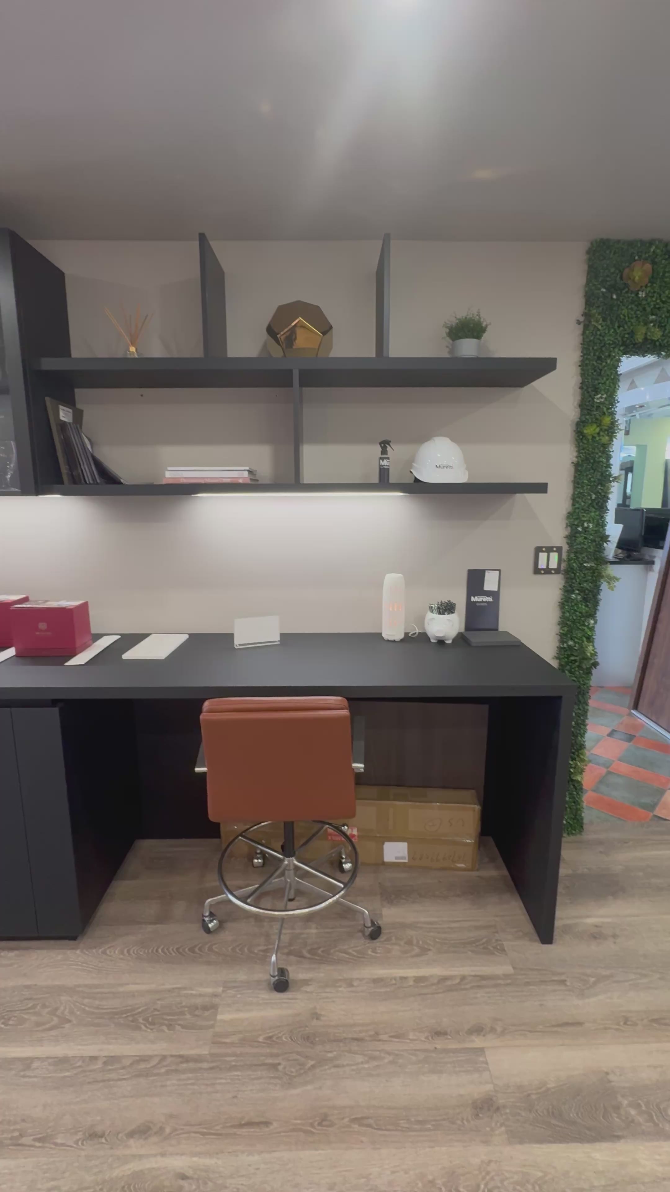 Load video: Muretti Modern Black Aluminum Framed Showroom Display Desk System with Storage and Open Shelving